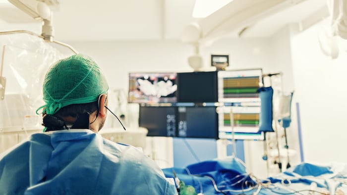 Cardiologist doing catheter ablation with radiofrequency energy using imaging system with fluoroscopic X-ray tube for interventional vascular procedures and electrophysiology. image guided system