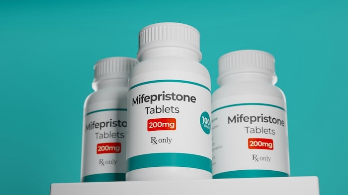 Three pill bottles of mifepristone.