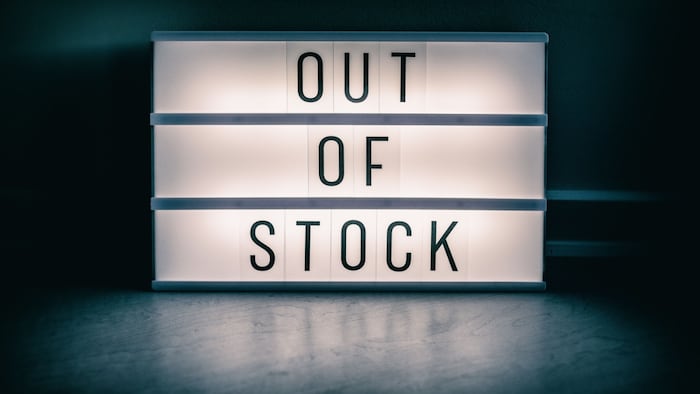 Illuminated sign that reads "Out of Stock."