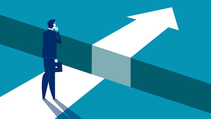 Person standing next to a gap in a path